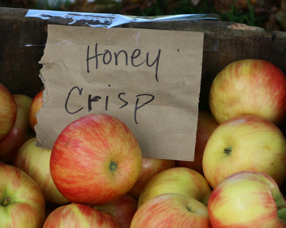 A crate of red and gold Honeycrisp apples